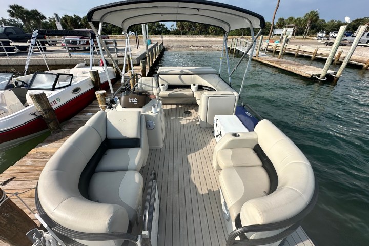 a boat is docked next to a body of water