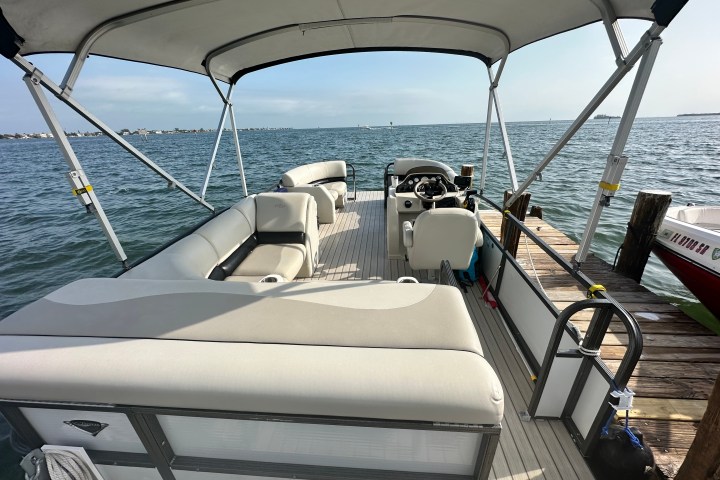 a boat is docked next to a body of water