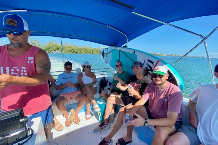 a group of people sitting on a boat