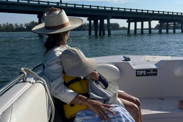 a person sitting on a boat in a body of water