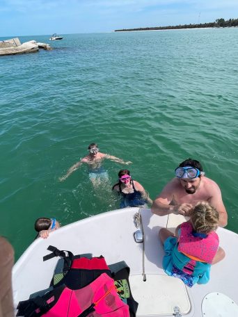 a group of people swimming in a body of water