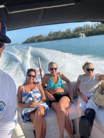 a group of people on a boat posing for the camera