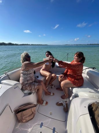 a person sitting next to a body of water