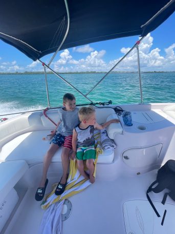 a group of people in a boat on a body of water