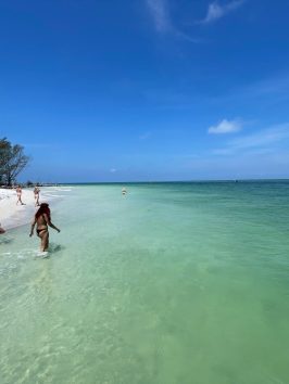 a man riding a wave on a surfboard in the water