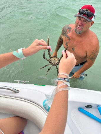 a man sitting on a boat in the water