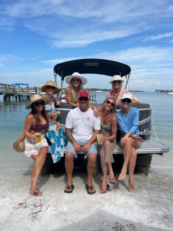 a group of people on a boat in the water