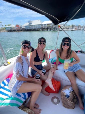 a woman sitting on a boat in a body of water