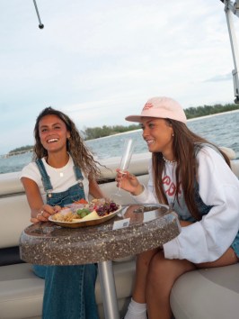 a person sitting on a boat in the water