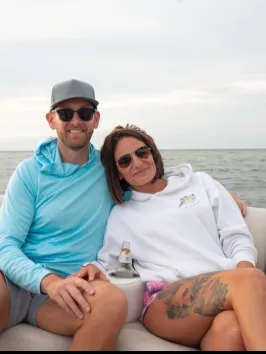 a person sitting on a boat in the water