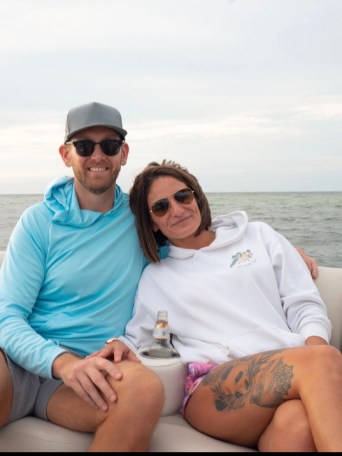 a person sitting on a boat in the water