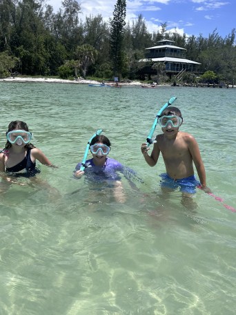 a group of people riding skis on a body of water