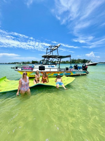 a group of people in a boat on a body of water
